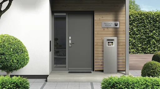 Tall weatherproof Luxer One outdoor package locker kiosk under a wood pergola in a multifamily courtyard